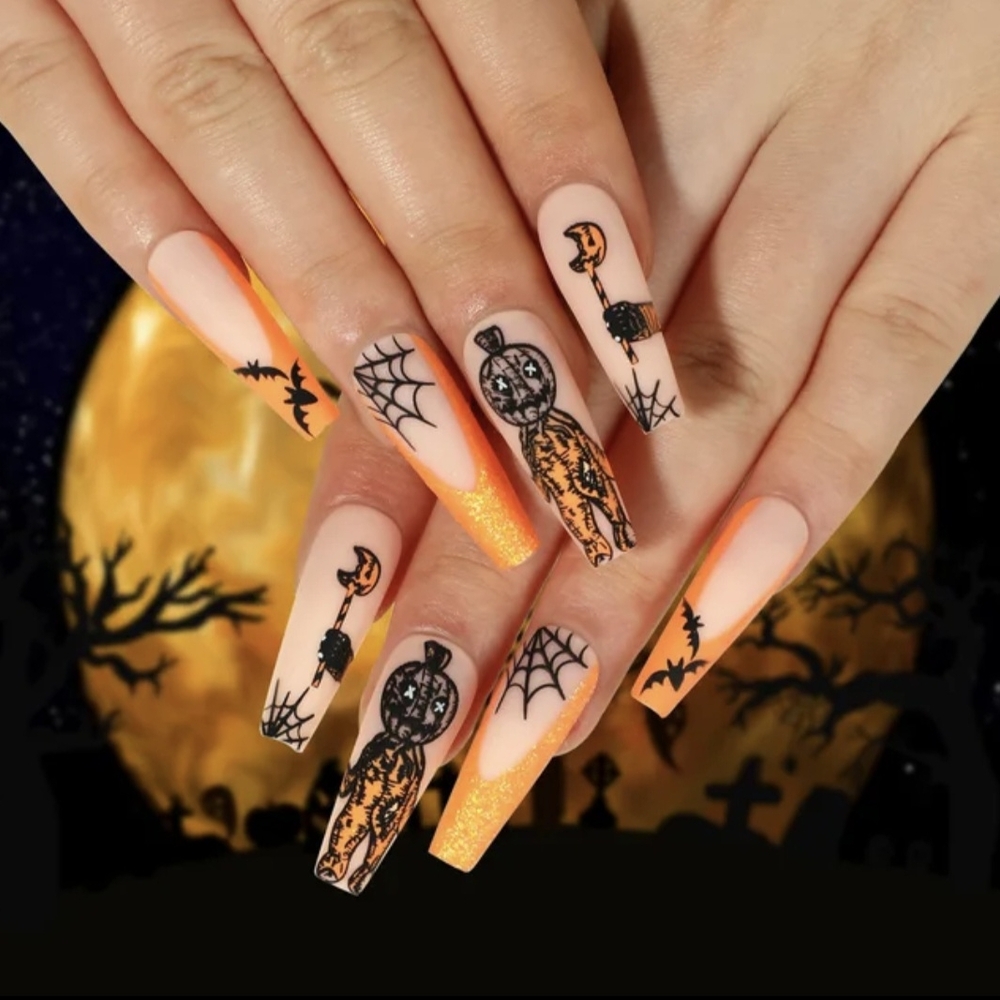 Halloween Themed Nail Art with Orange and Black Design